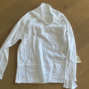 Brand new with tags Escape long sleeve tunic. Has a cowl neck and one pocket .